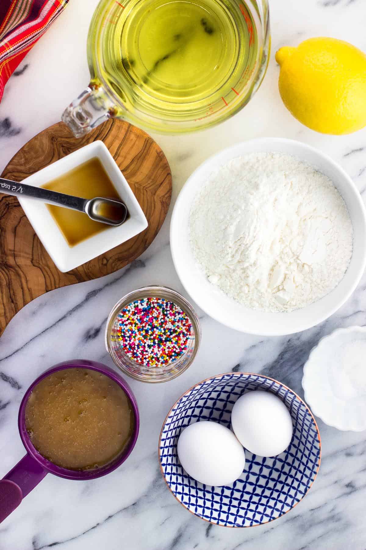 An overhead picture of all of the ingredients in separate containers on a marble board