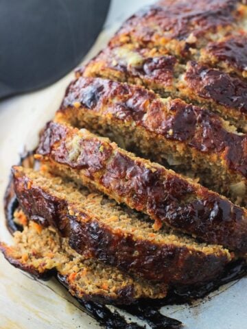 Sliced meatloaf on a baking sheet