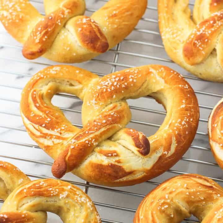 Pretzels cooling on a metal wire rack