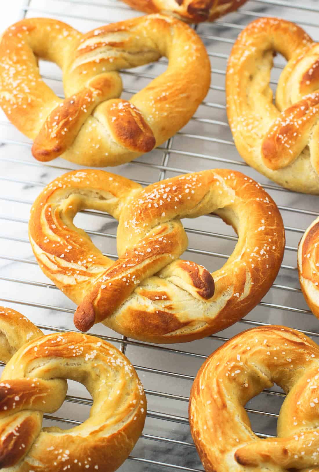 Pretzels cooling on a metal wire rack