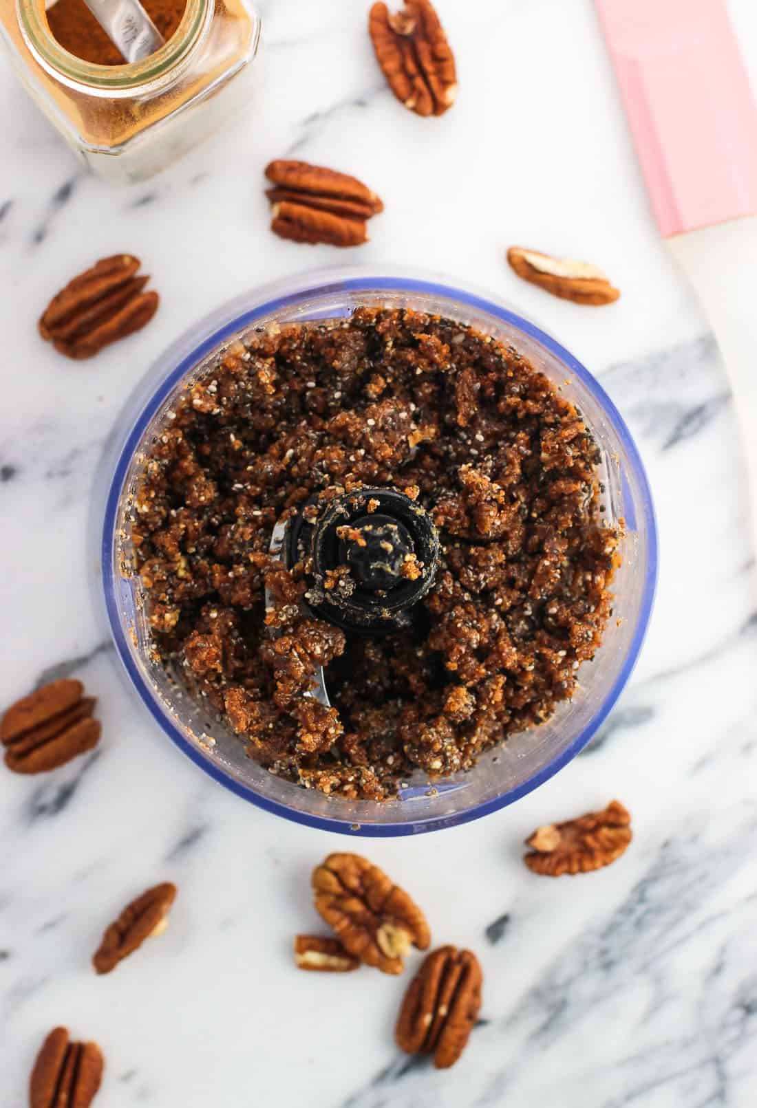 Blended together chia bar ingredients in a small food processor.