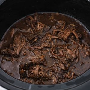 slow cooker shredded beef with balsamic peanut sauce