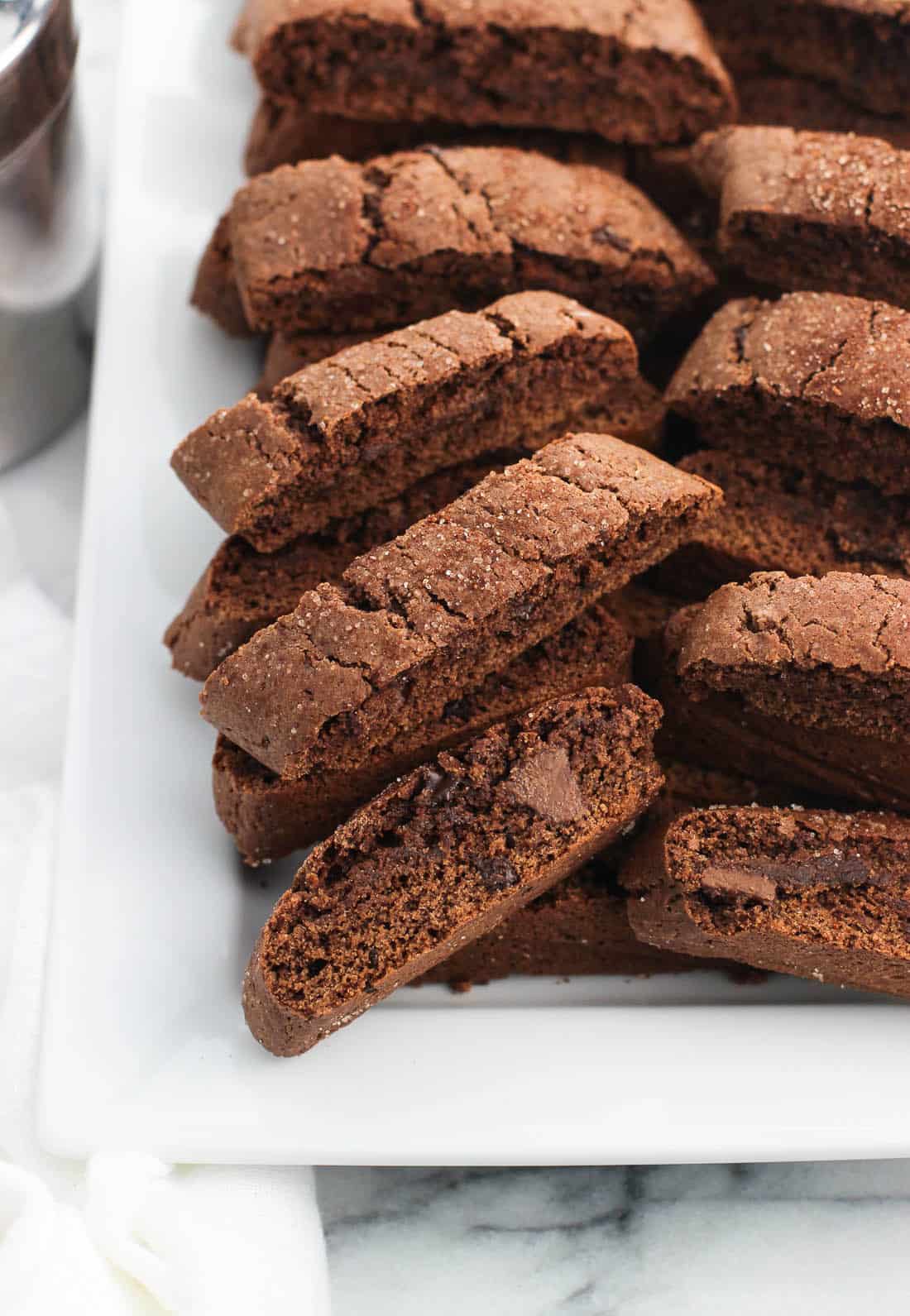 A rectangular ceramic tray of stacked biscotti 