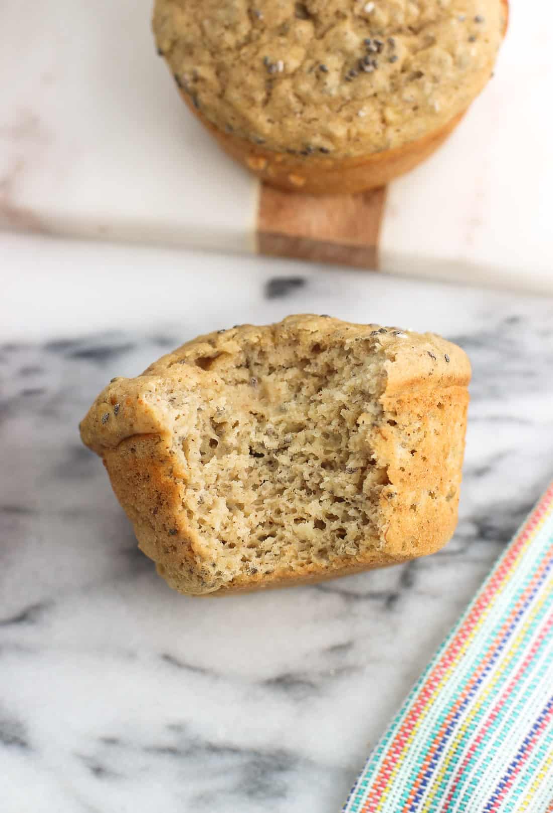 A close-up image of a muffin on its side with a bite taken out of it