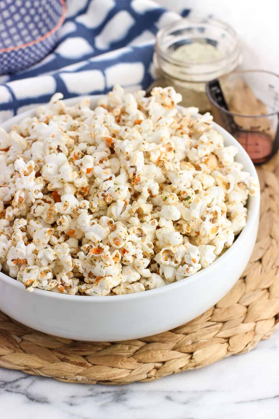 A serving bowl filled with seasoned popcorn.