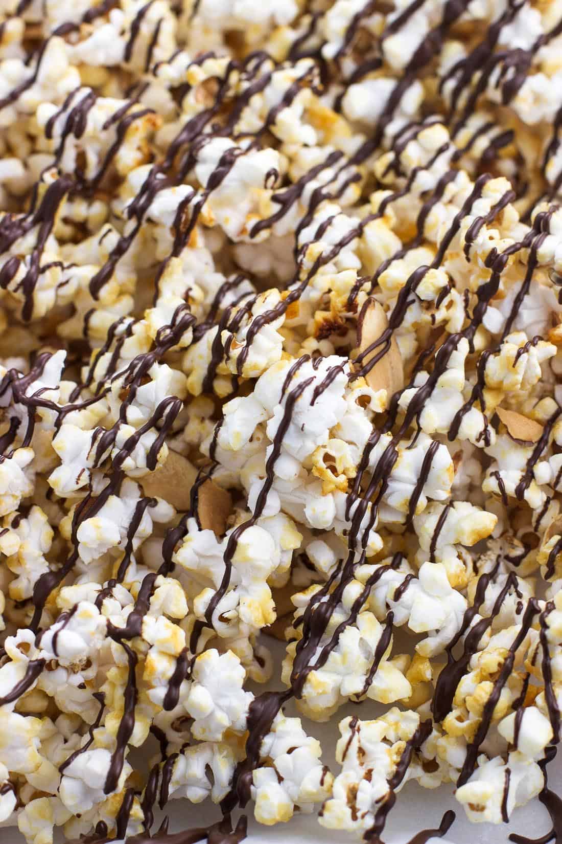 A close up of kettle corn drizzled with dark chocolate