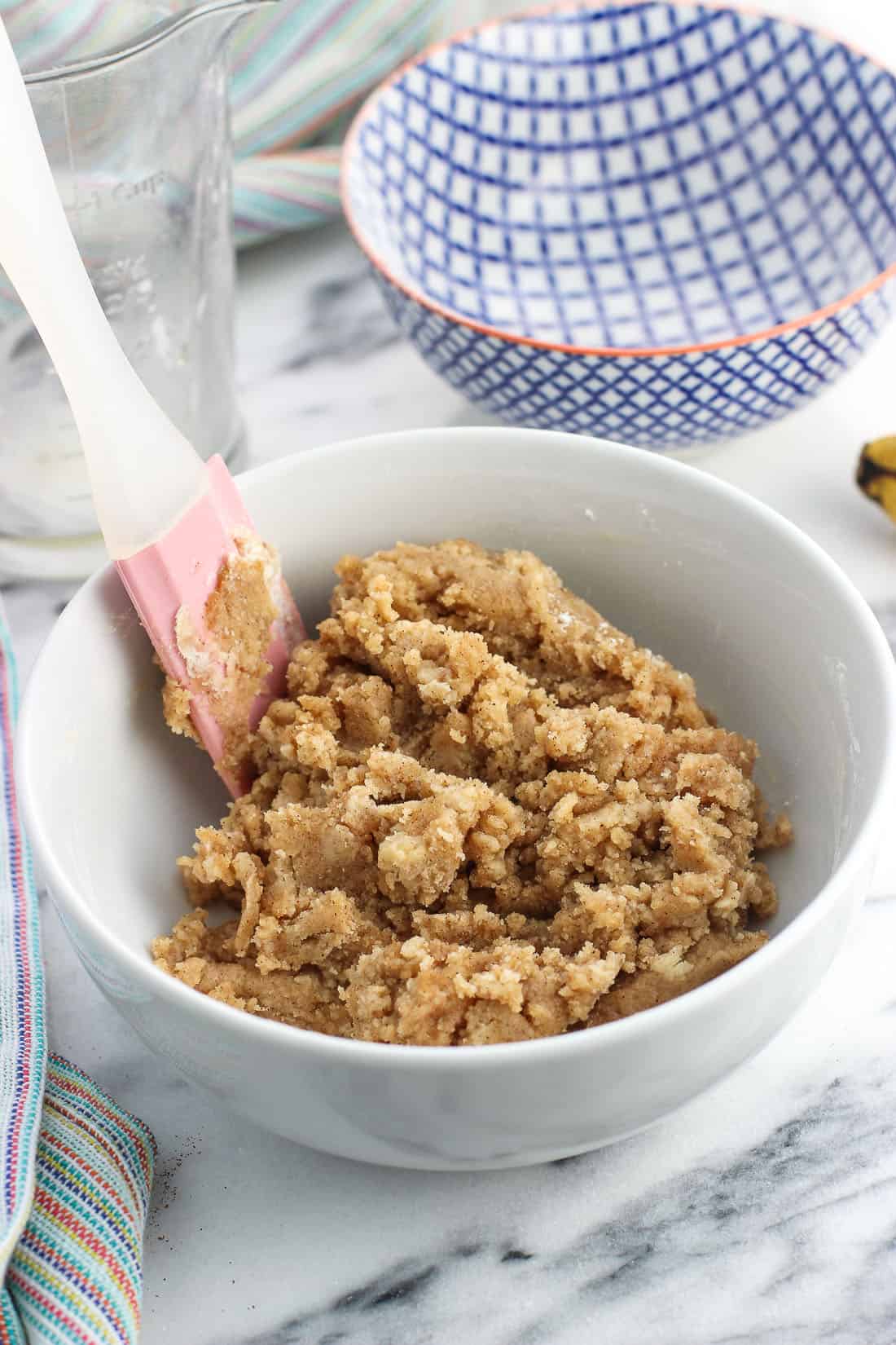 Crumb topping in a bowl ready to be sprinkled on a dessert.