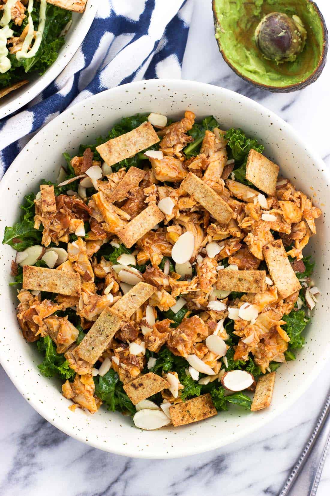 An overhead picture of the salad in a ceramic bowl before adding dressing.