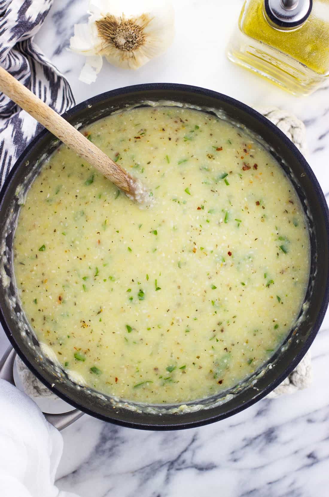 All ingredients stirred into the liquidy grits mixture in a saucepan