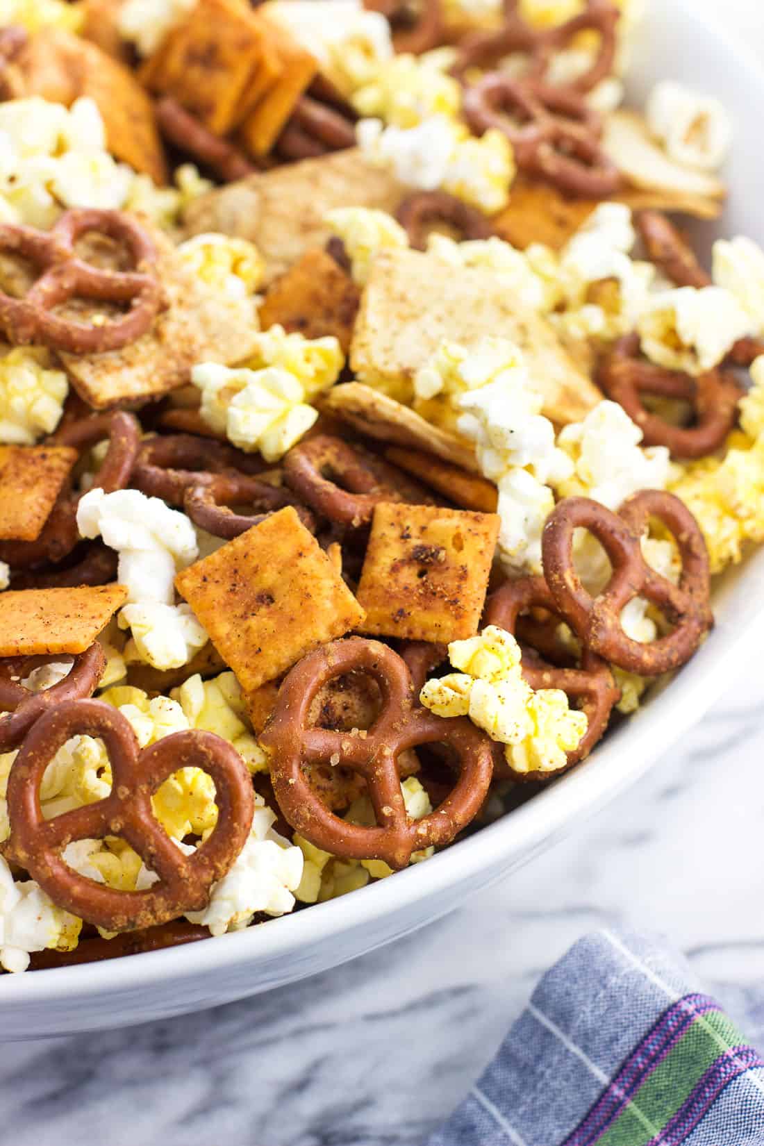 Assembled popcorn snack mix in a large serving bowl