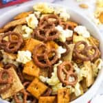 A bowl of popcorn snack mix