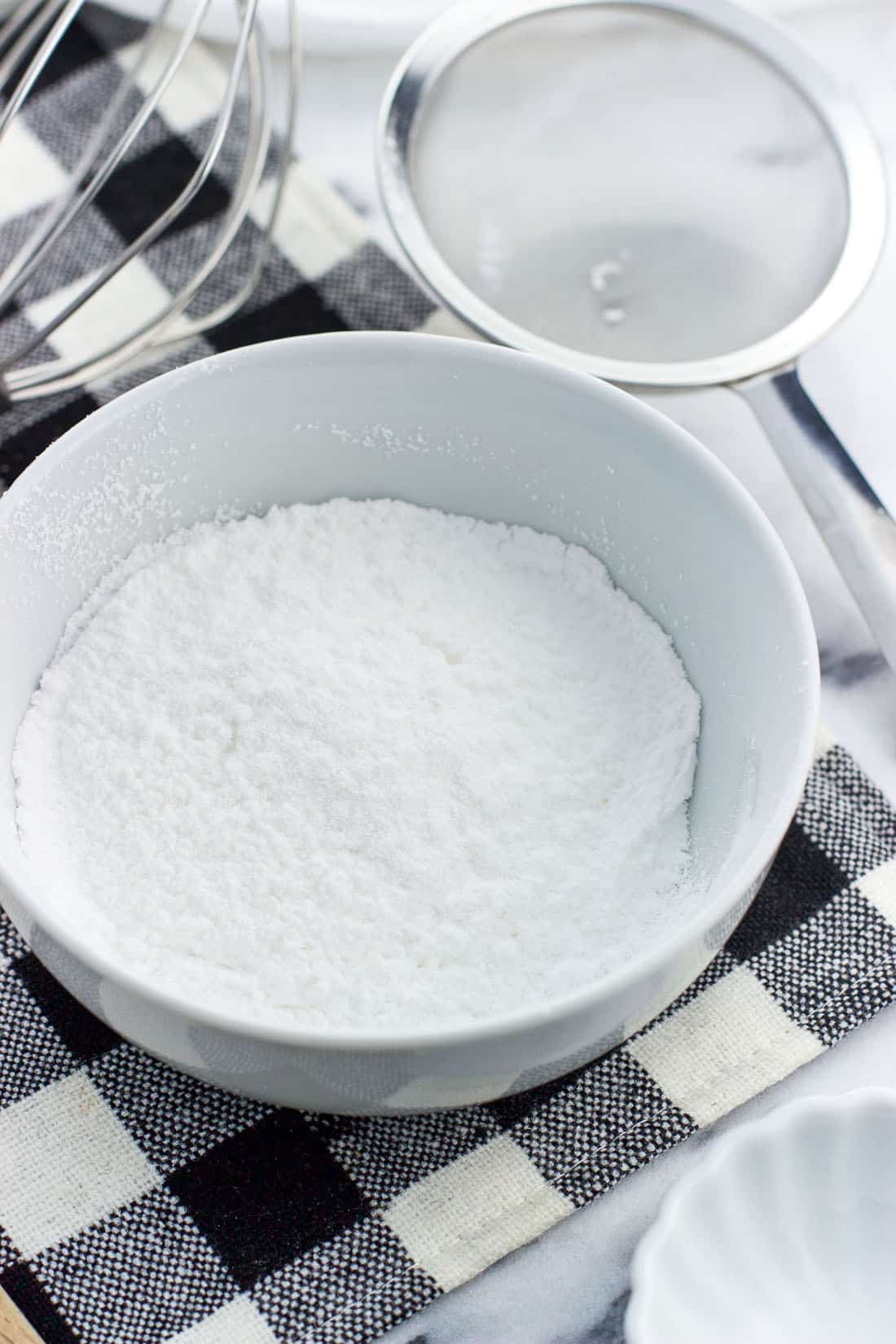 Sifted powdered sugar in a bowl.