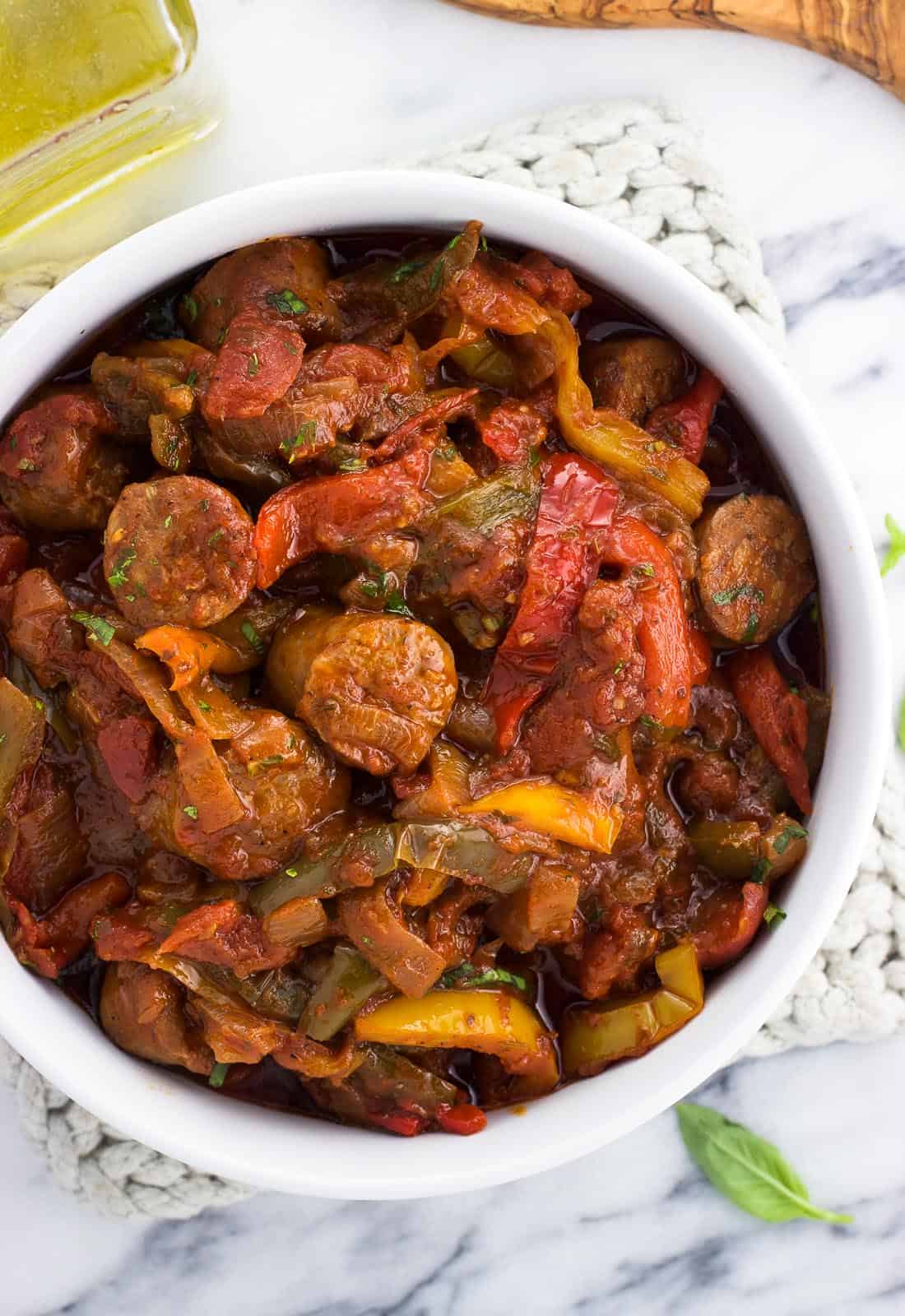 Sausage and peppers in a big serving bowl.