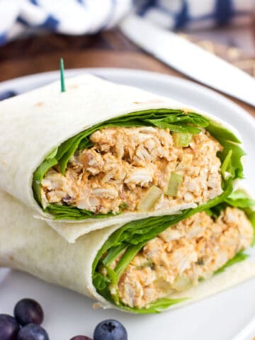 A chicken salad wrap sandwich on a plate