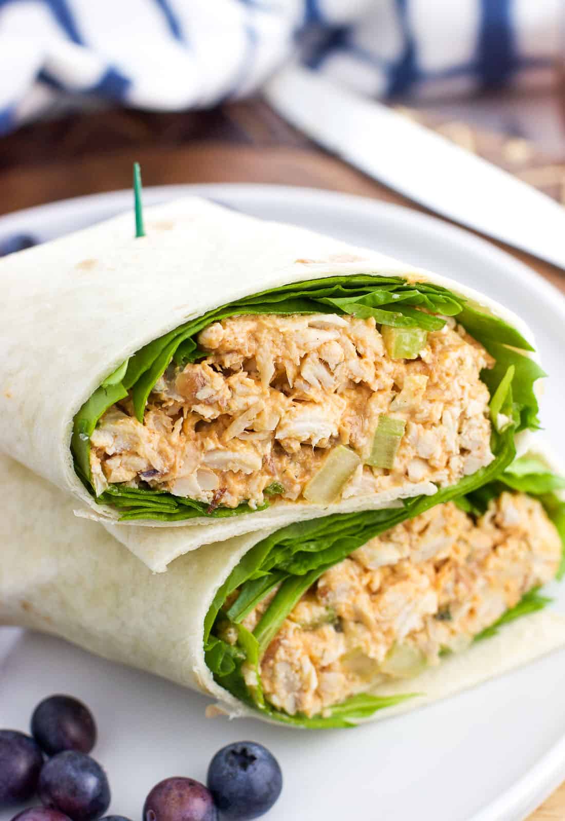 A buffalo chicken salad wrap sandwich on a plate