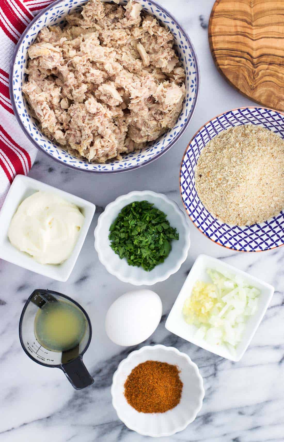 An overhead shot of the baked tuna cake ingredients in separate bowls.