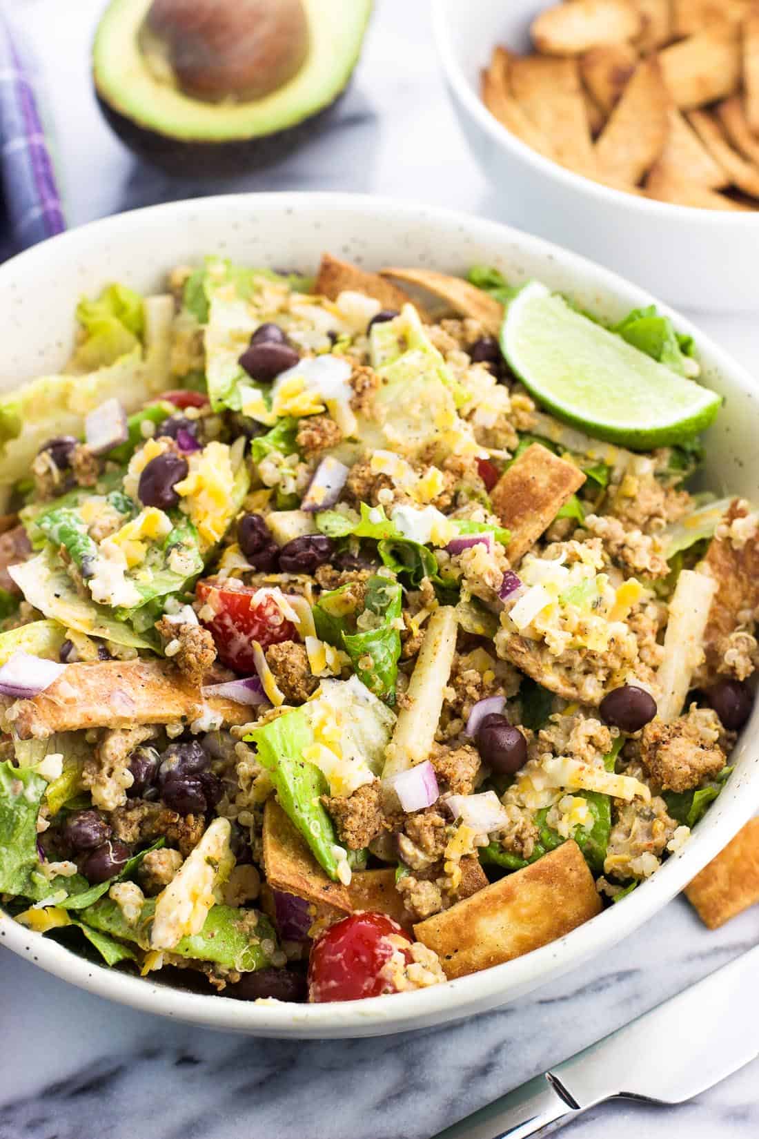 All of the turkey taco salad ingredients mixed together in a bowl for serving