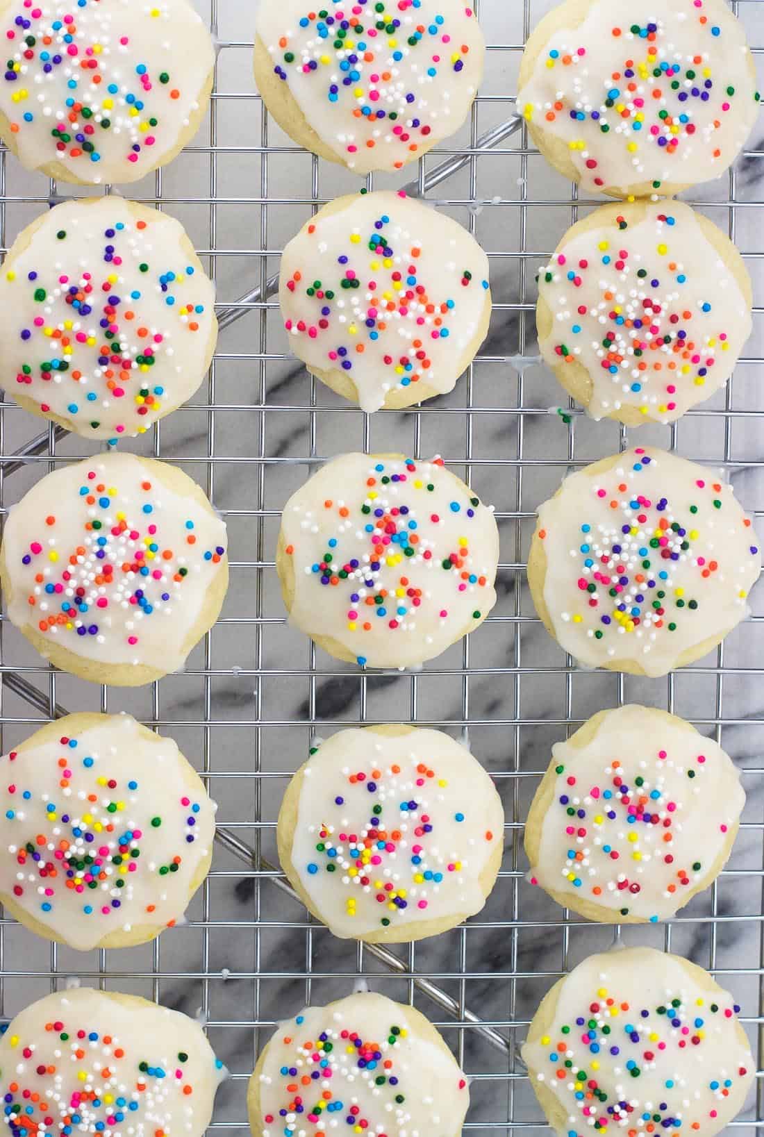 An overhead shot of lemon ricotta cookies on a wire rack