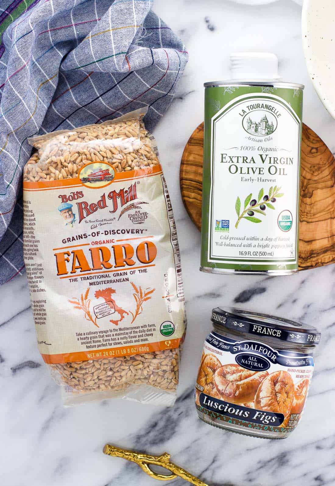 An overhead shot of farro, olive oil, and figs from iHerb