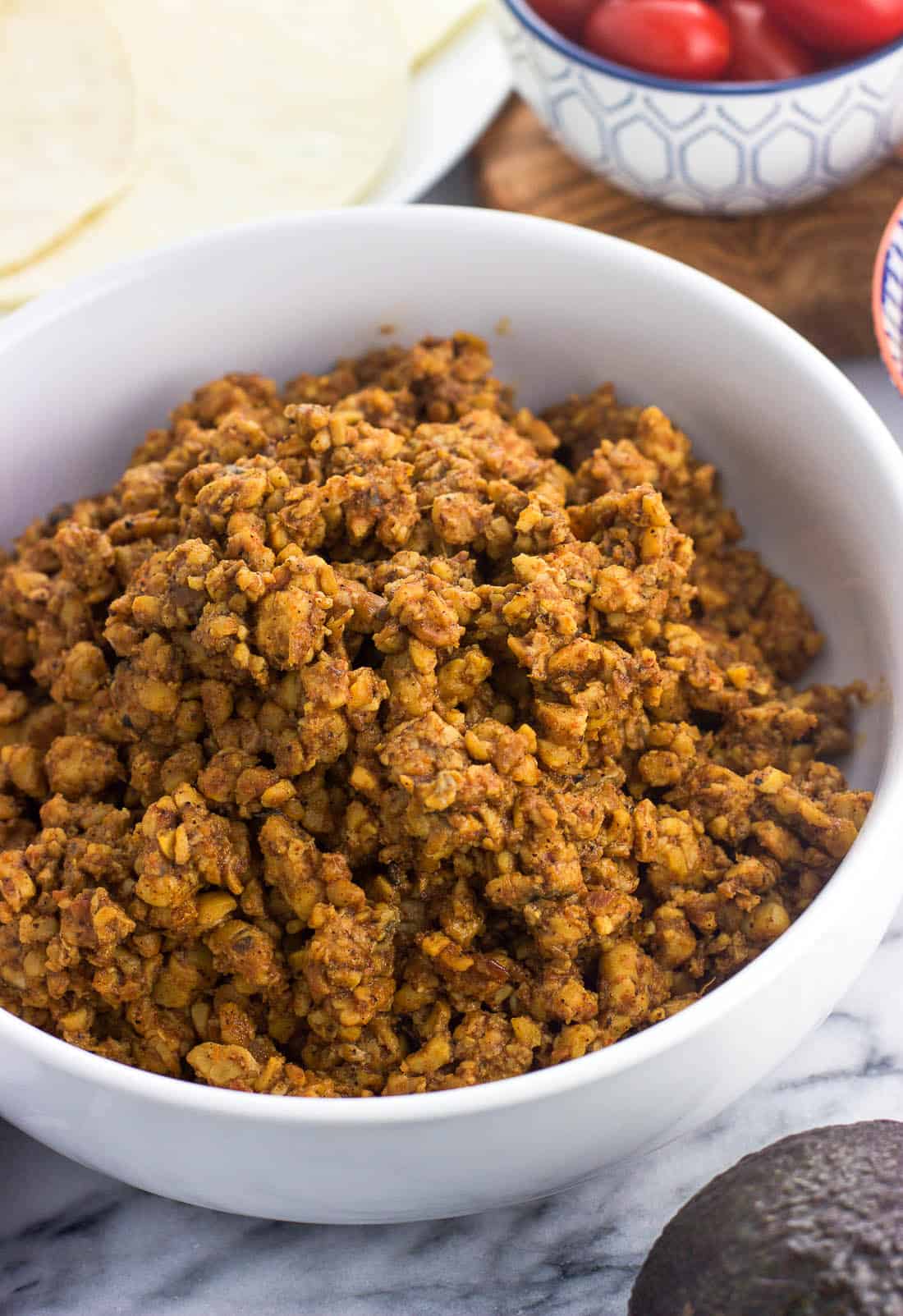 Cooked and seasoned tempeh in a serving bowl