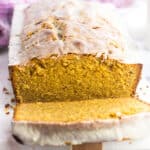 Pound cake served on a marble board with a tea towel in the background