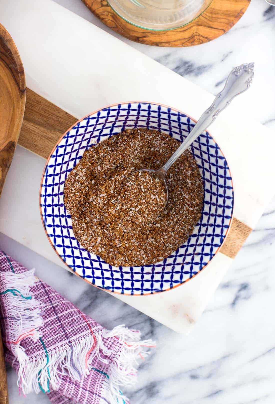 All of the spices stirred together in a small bowl with a spoon