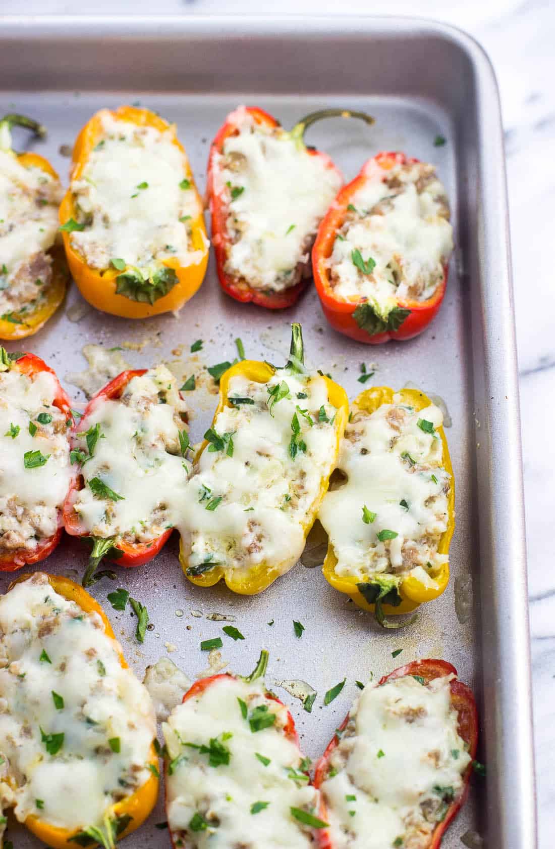 Sausage stuffed mini peppers after being baked.