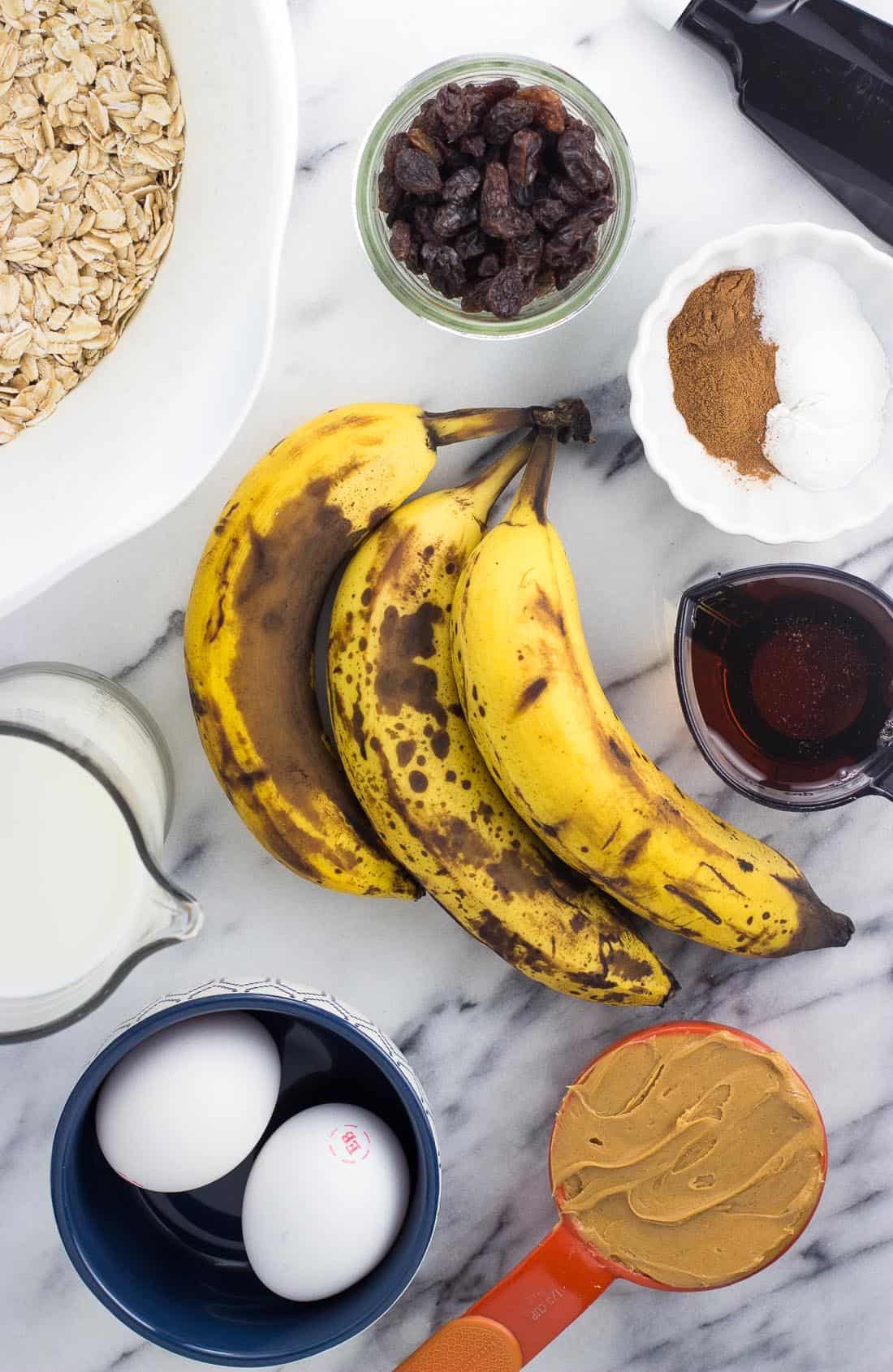 An overhead picture of these peanut butter baked oatmeal ingredients on a marble board.