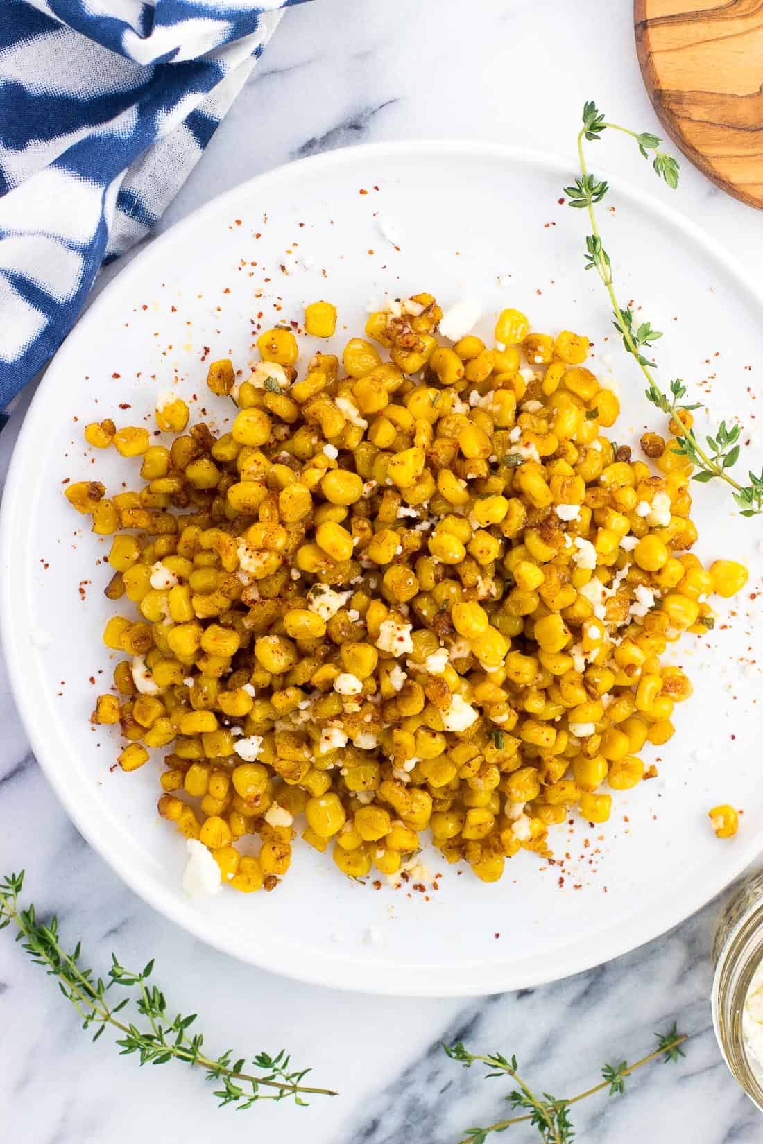 An overhead picture of roasted skillet corn on a plate