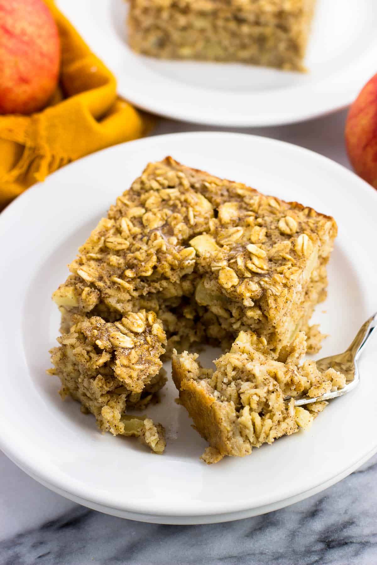 Forkfuls of baked oatmeal removed from the piece with a fork.