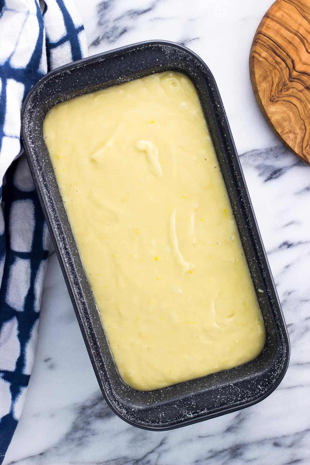 Batter poured into the prepared loaf pan before baking.