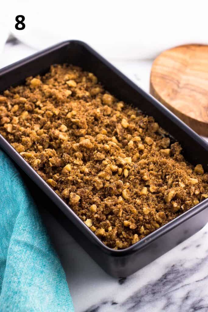Streusel-topped batter in a loaf pan before baking.