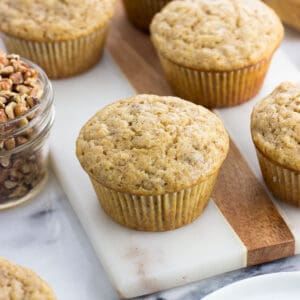 Banana nut muffins on a marble board.