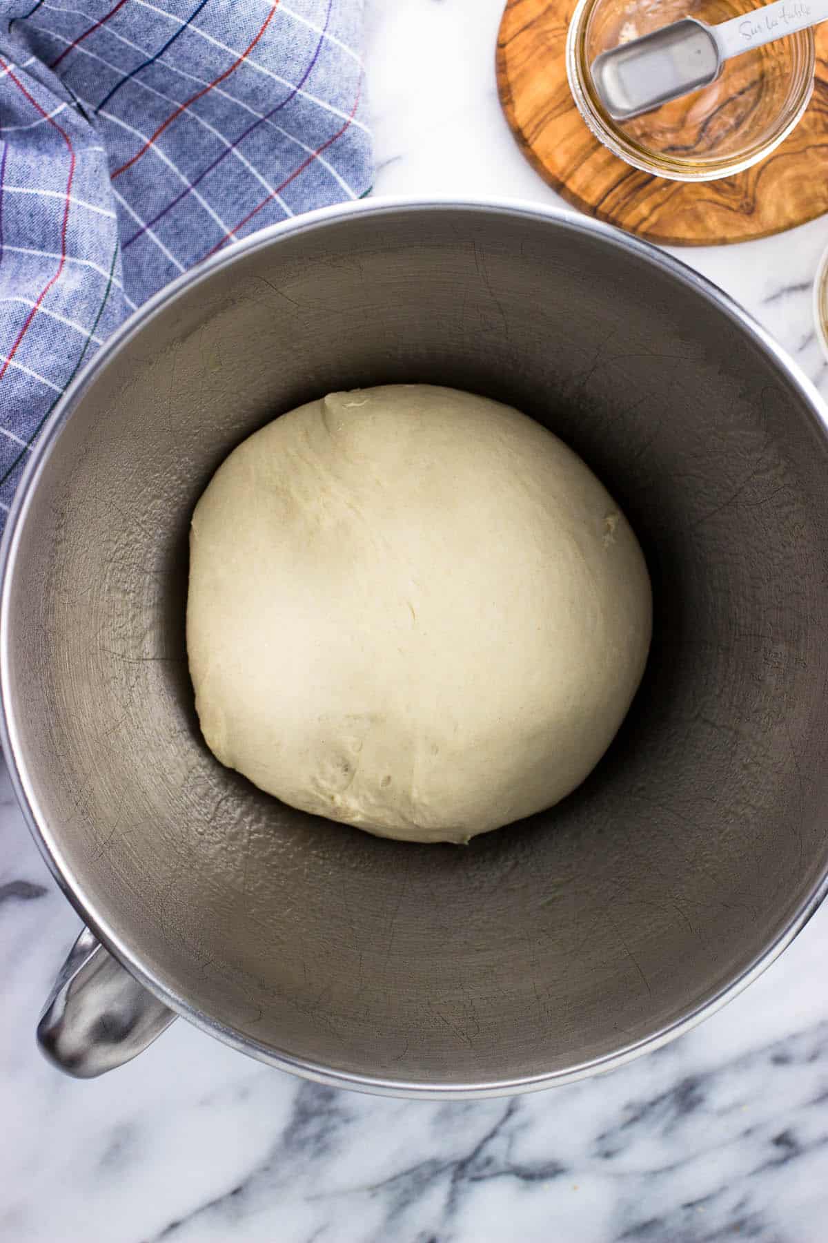 A ball of dough in a bowl pre-rise.
