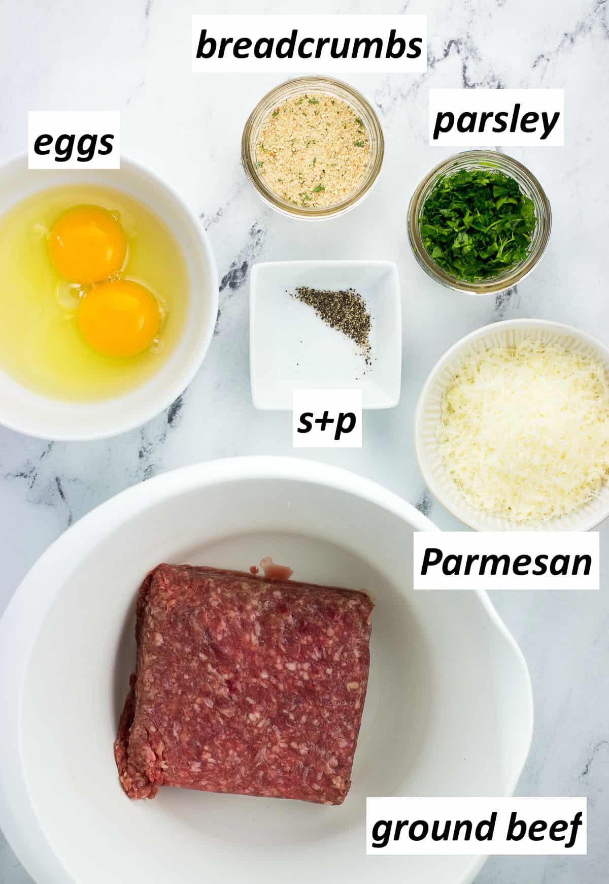 Meatball ingredients in separate bowls before being combined.