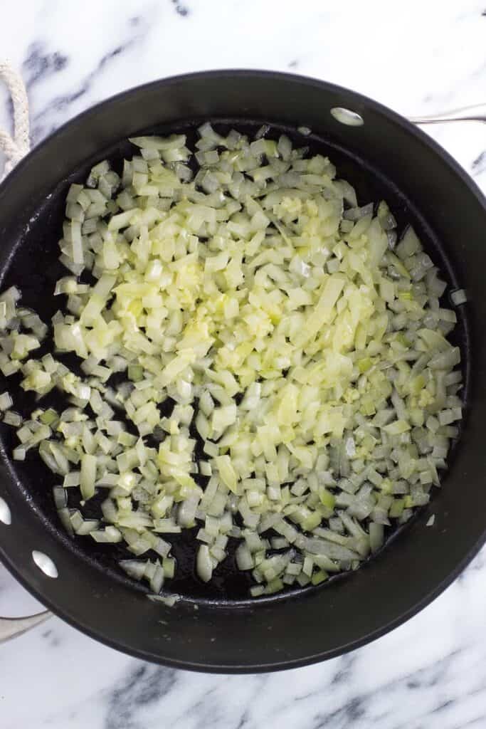 Sauteed onions and garlic in a sauce pan.