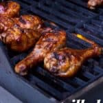 BBQ drumsticks on the grill with recipe name text overlay.