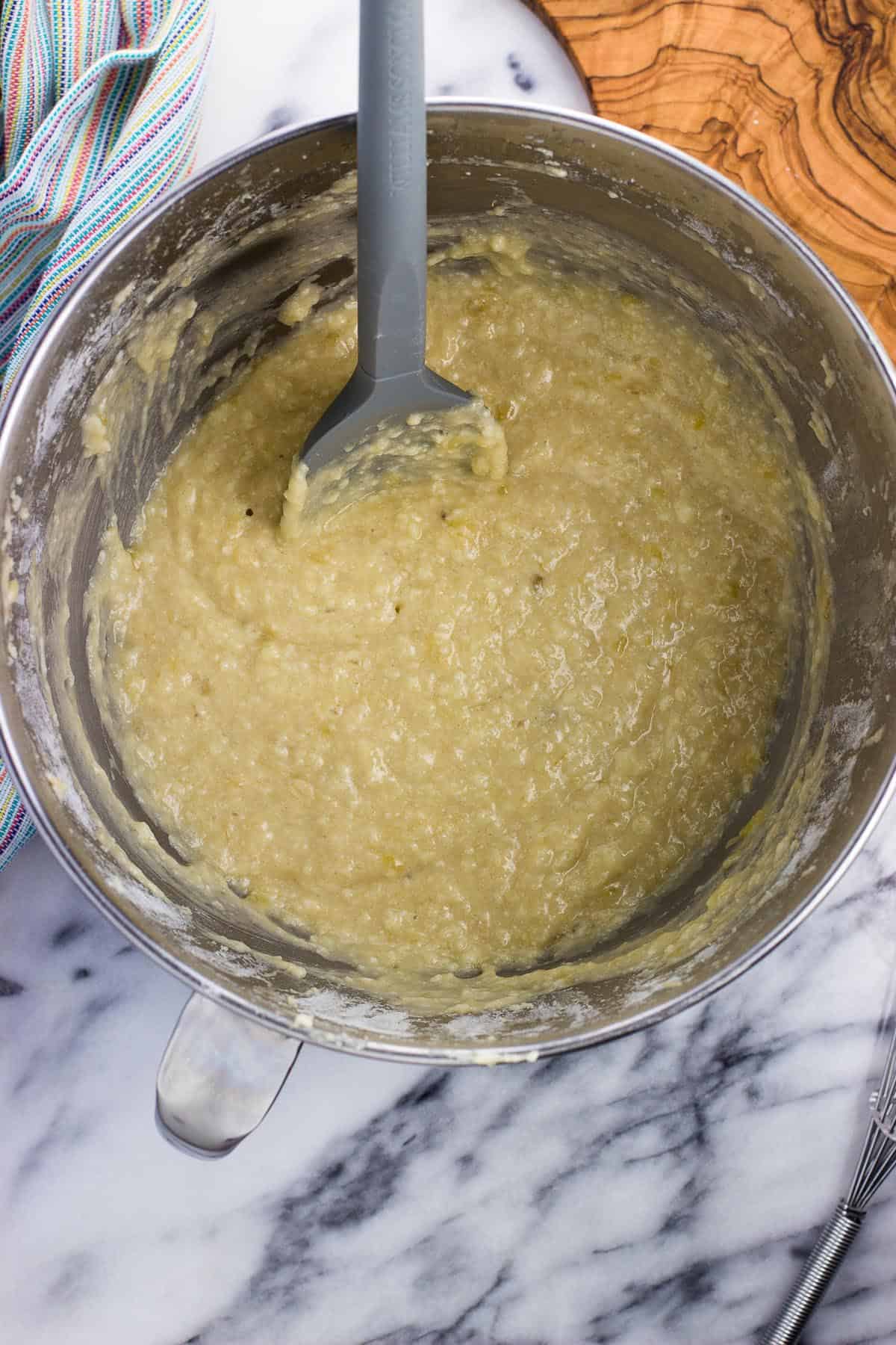 Dry ingredients stirred into the bowl with the wet with a spatula.