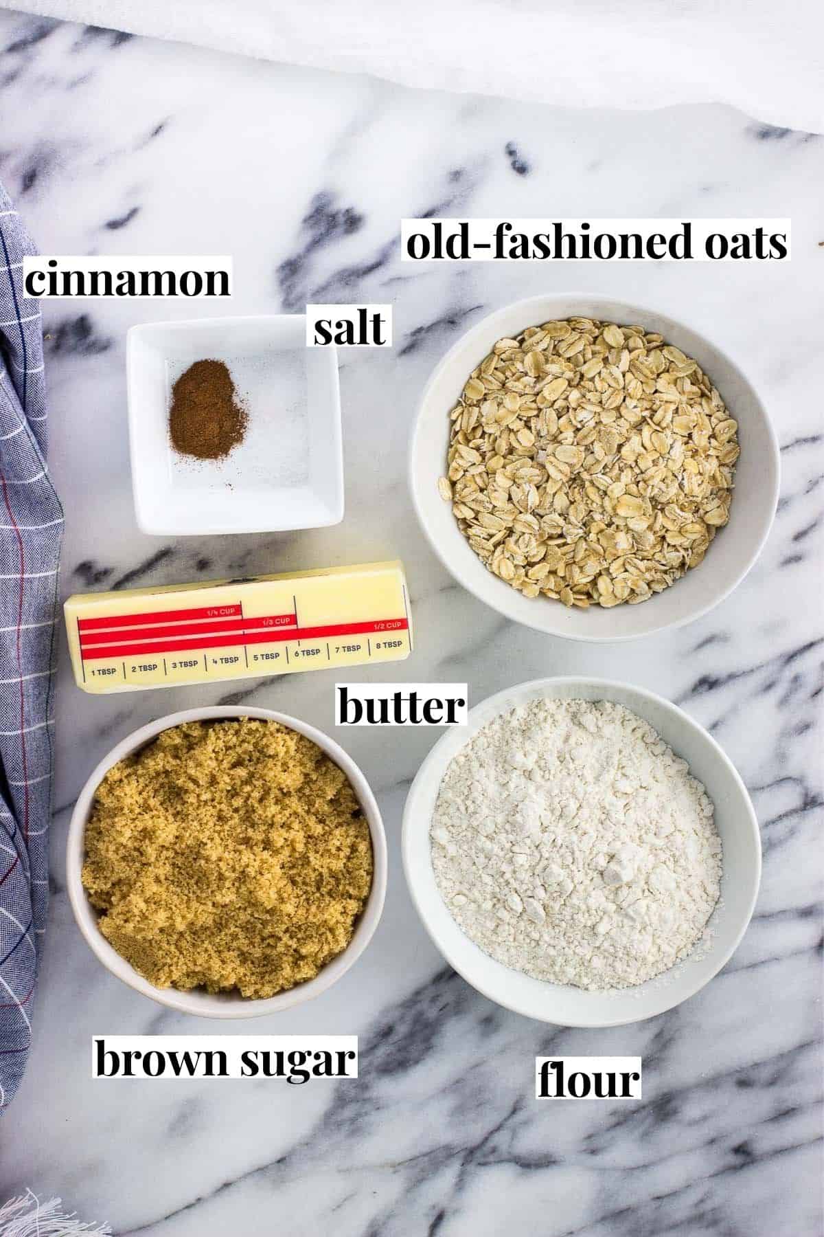 Labeled oat crisp topping ingredients in separate bowls.