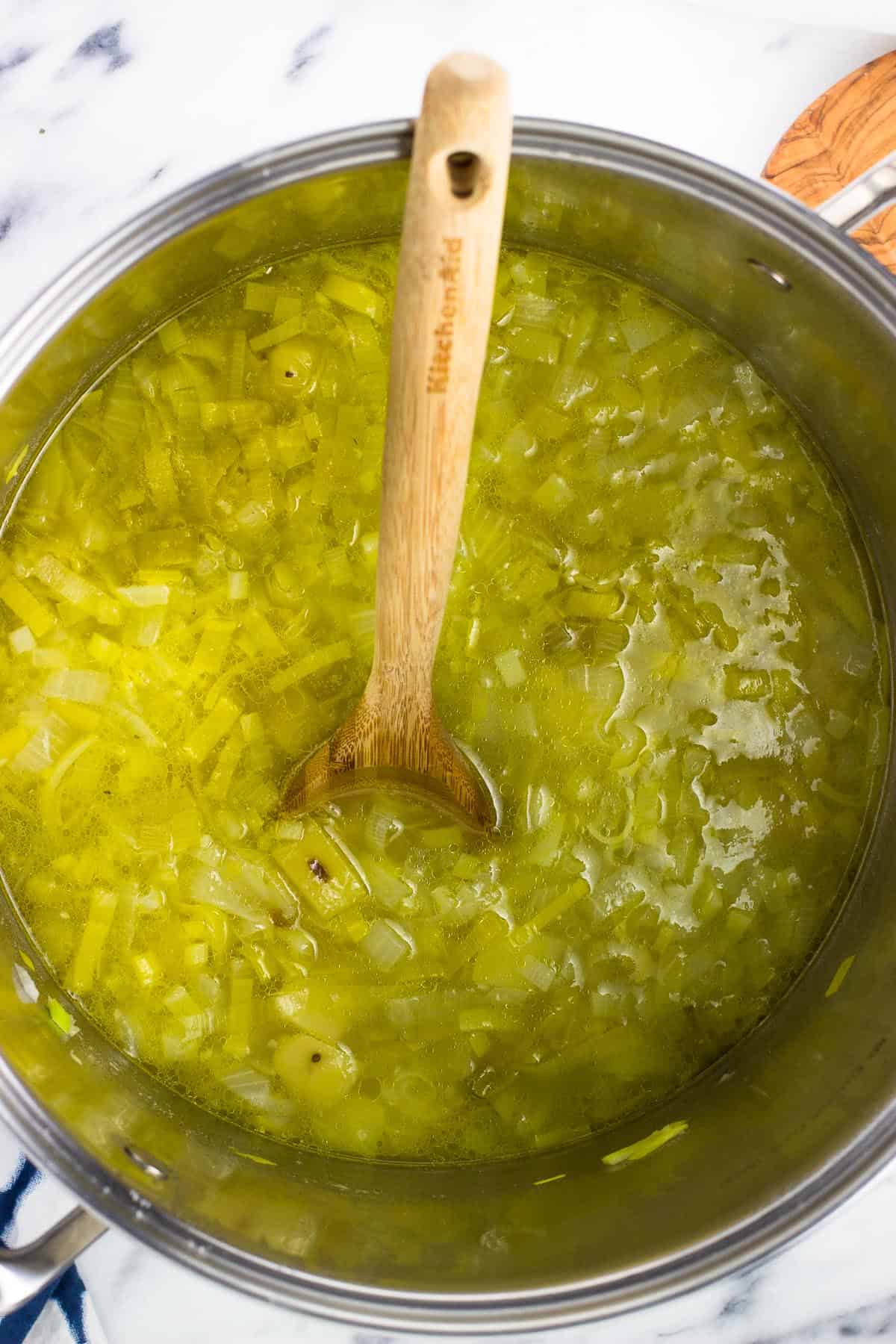 A wooden spoon in the soup pot before pureeing.