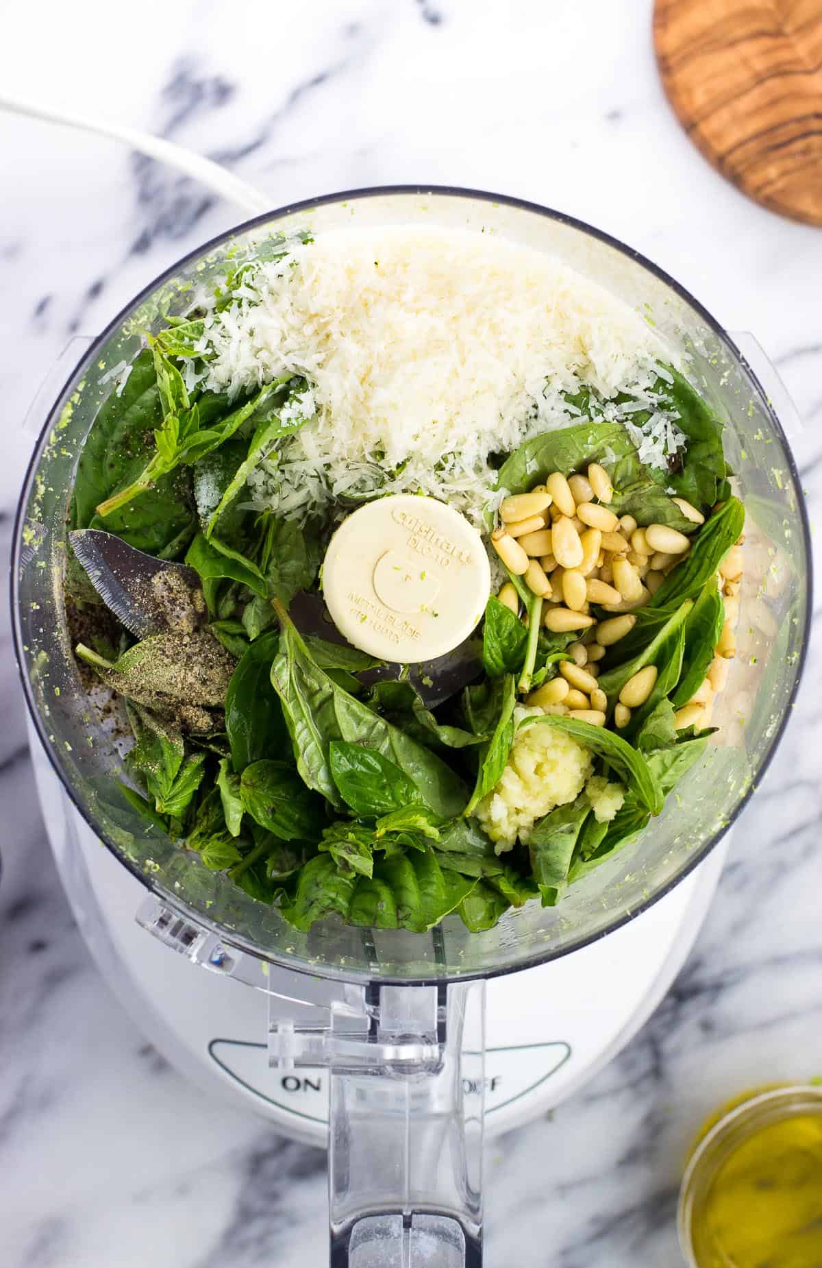 Basil pesto ingredients in the food processor.