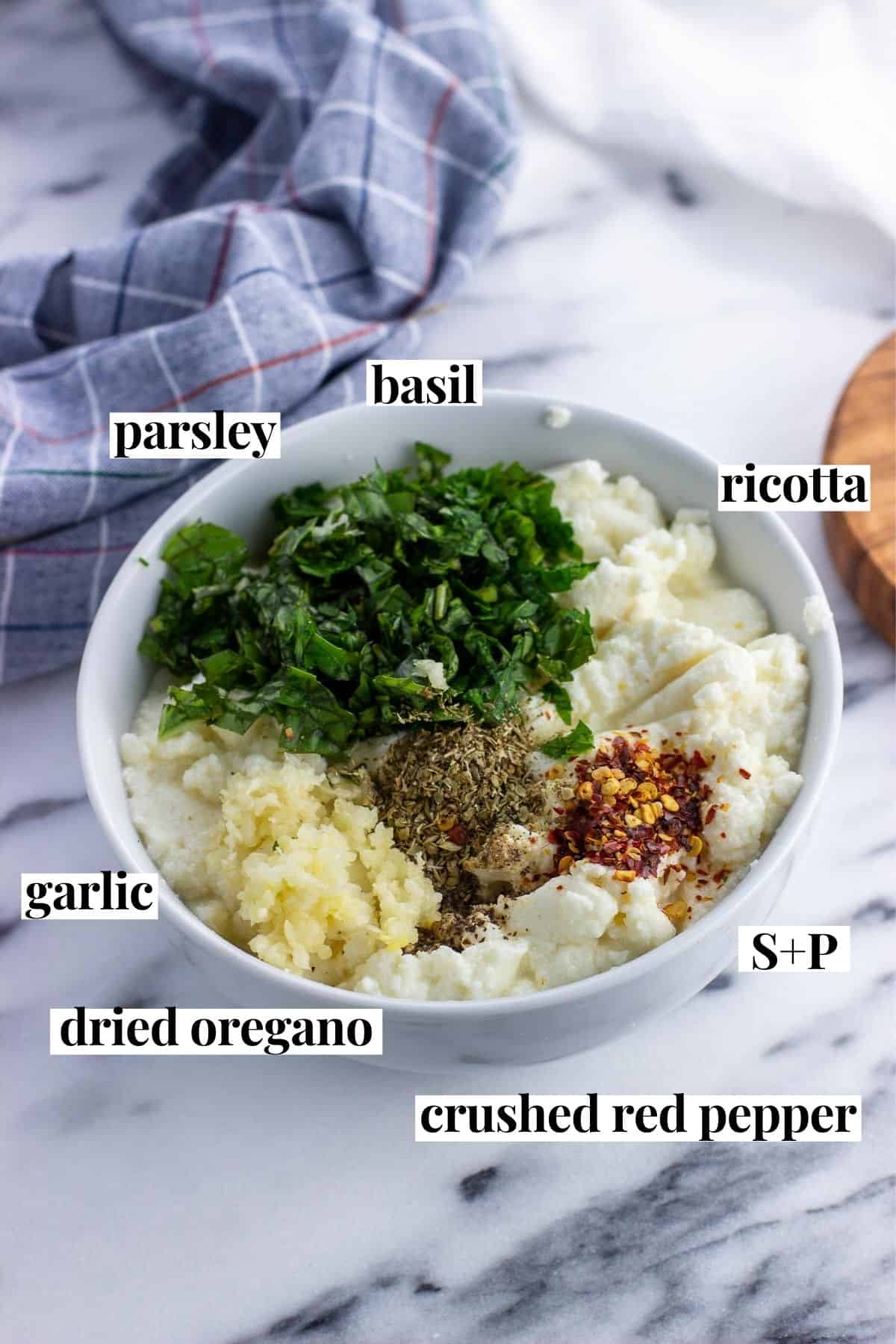 Labeled ricotta filling ingredients in a bowl.