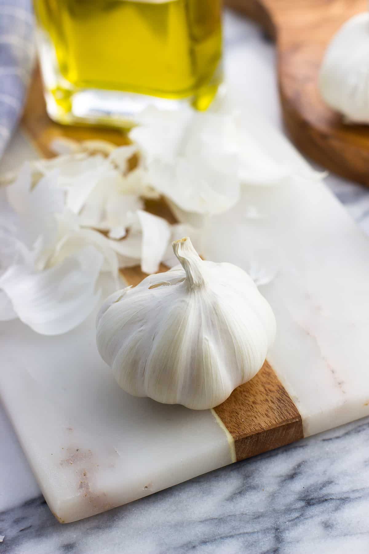 A garlic head peeled down to the innermost layer of skin.