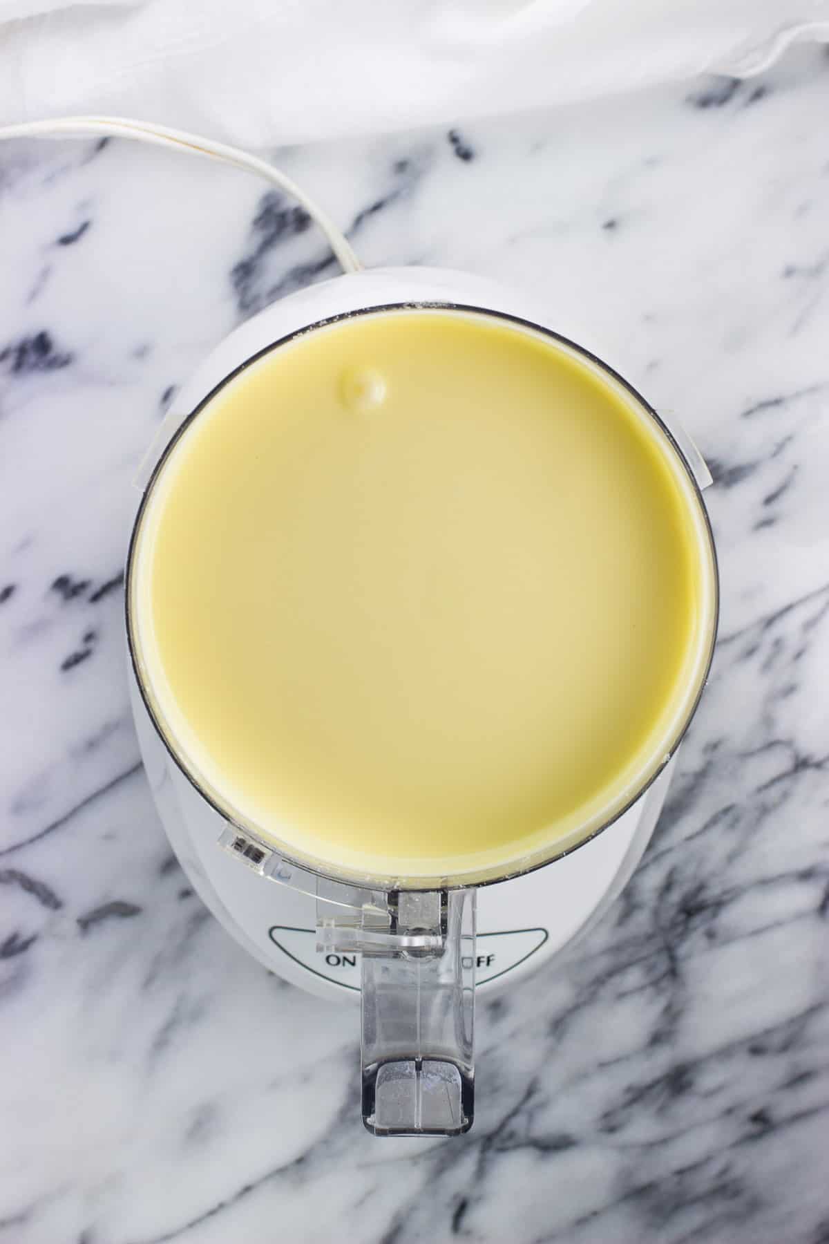 Blended cheesecake mixture in-process in the food processor.
