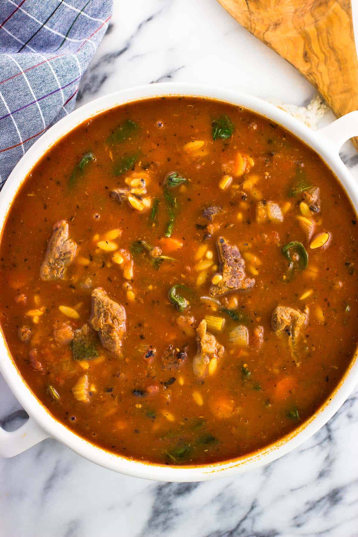 A large ceramic pot of soup.