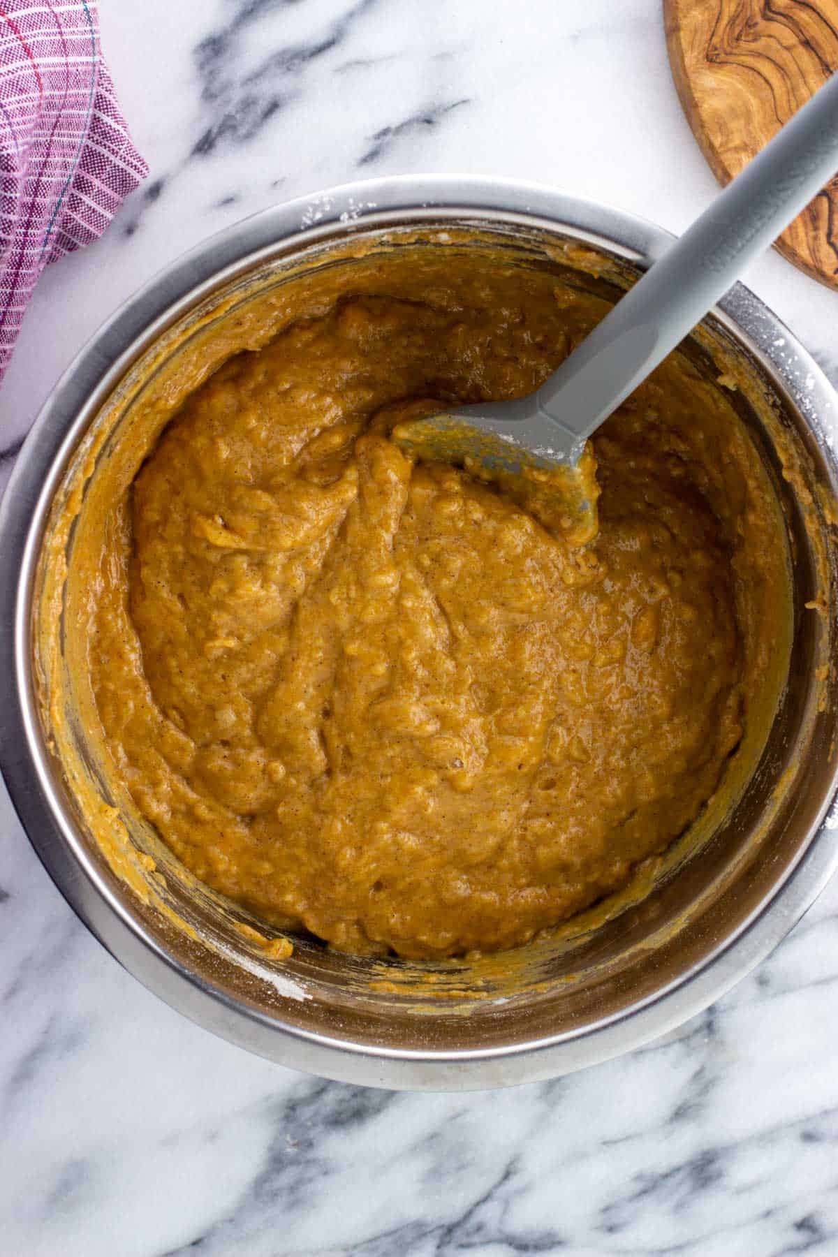 Batter stirred together with a spatula in a bowl.