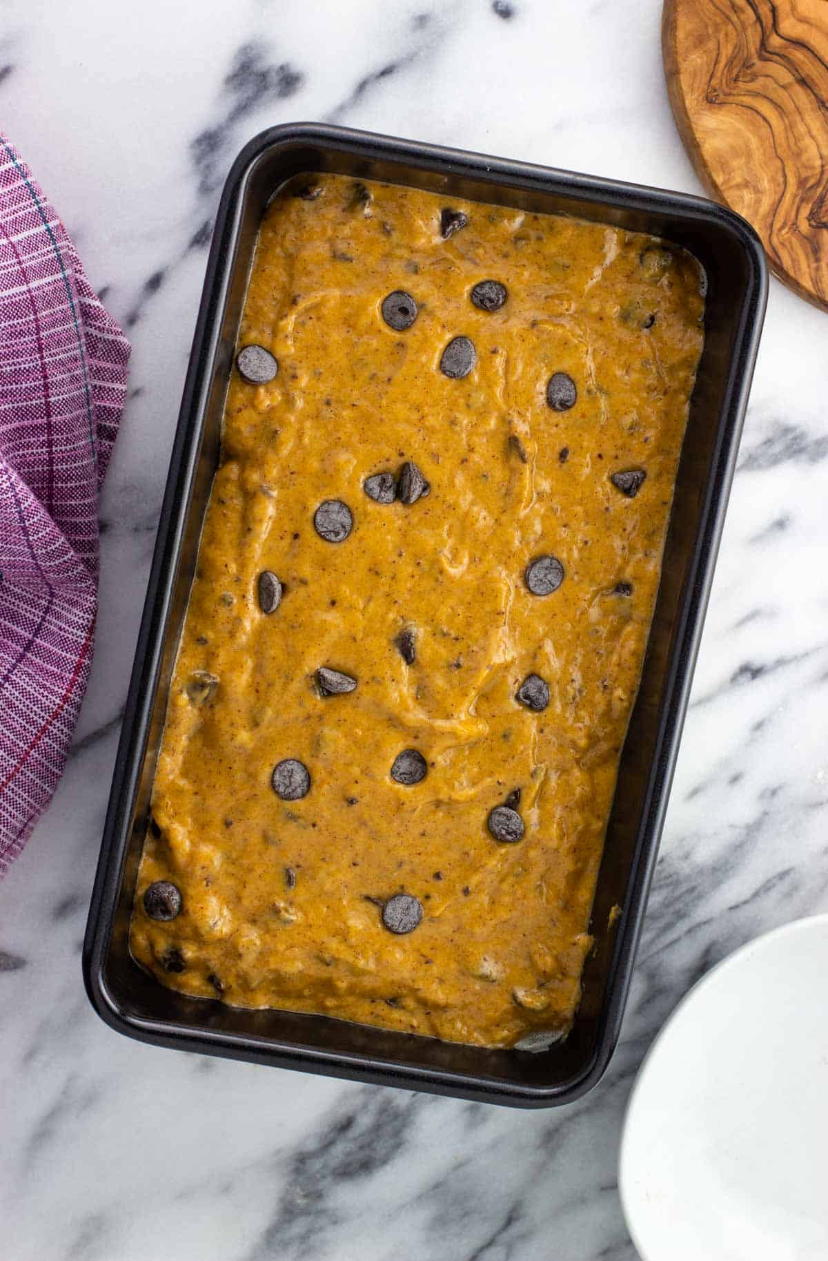 Batter poured into a loaf pan before baking.