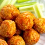 A close-up of a pile of saucy buffalo chicken meatballs.