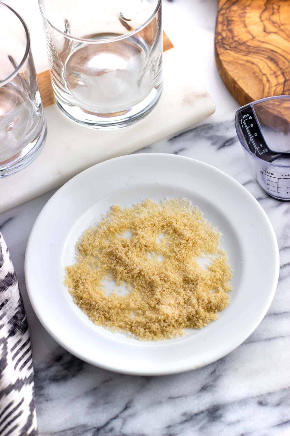 Brown and granulated sugars combined on a small plate.