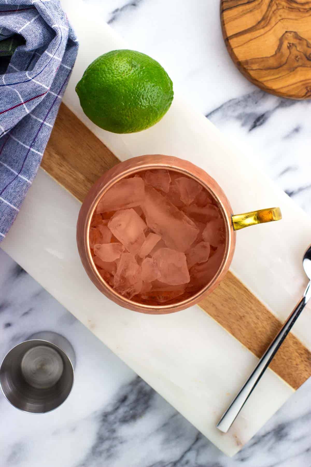 Crushed ice in a copper Moscow mule cup.